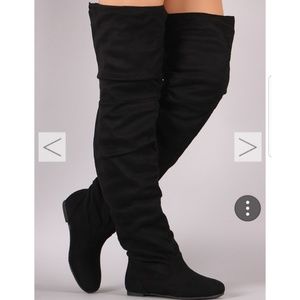 Over the knee flat boots